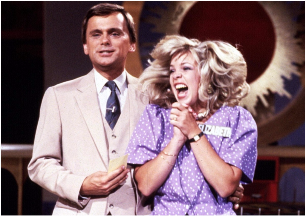Pat Sajak with a contestant on the set of Wheel of Fortune during the 1980s 